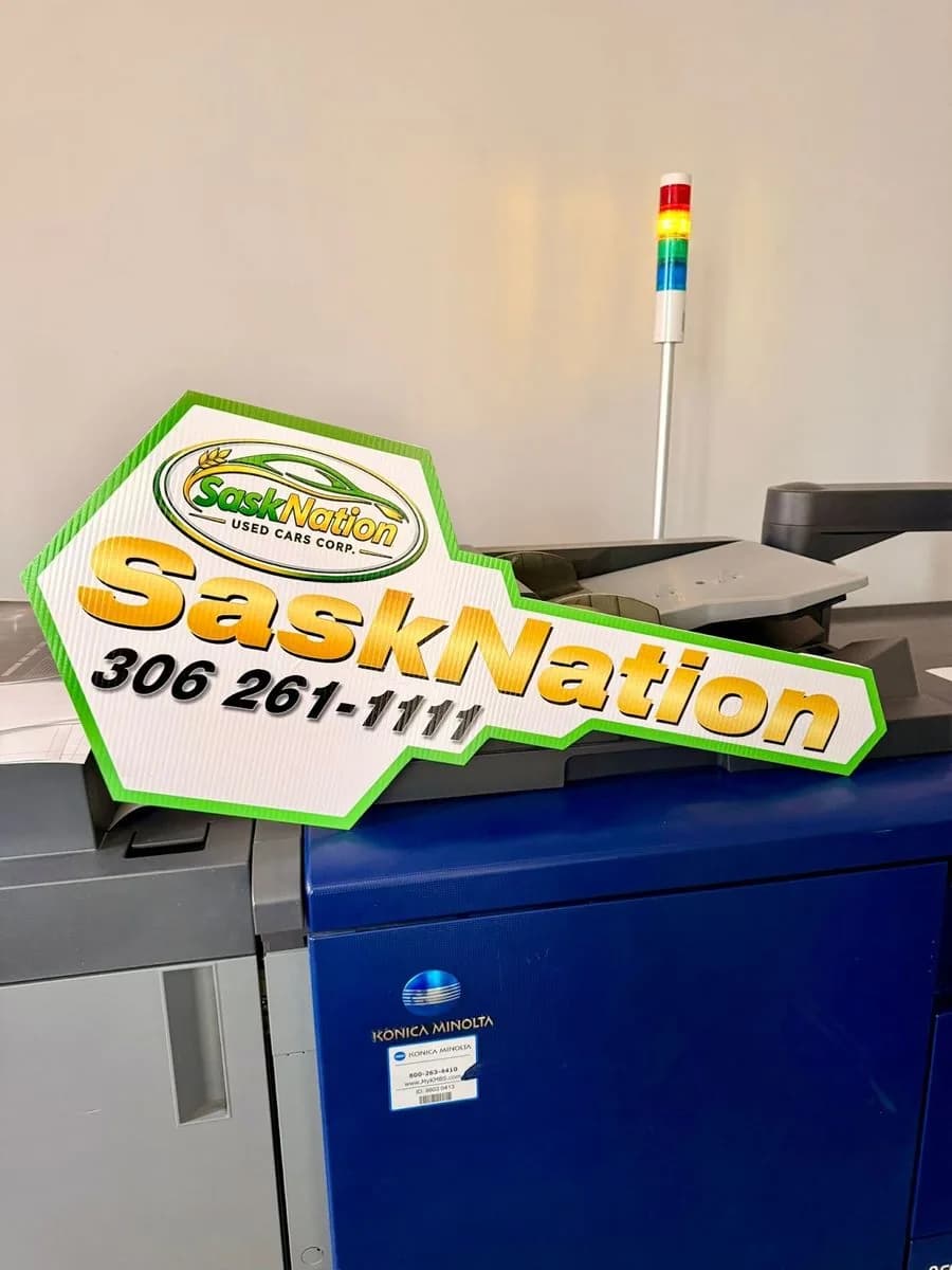 SaskNation custom-shape arrow sign printed in Saskatoon by True Color