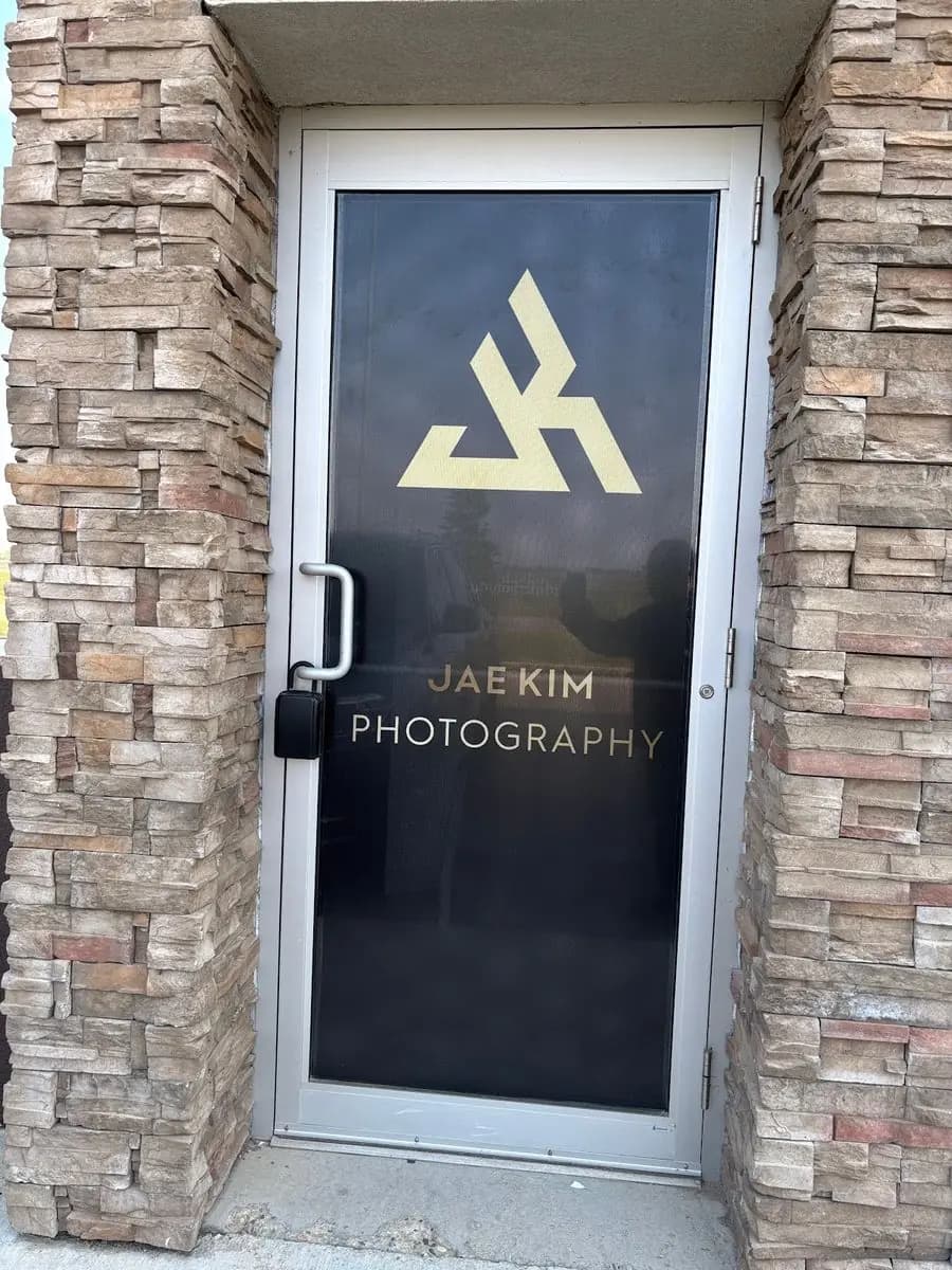 Jae Kim Photography gold door decal installed in Saskatoon