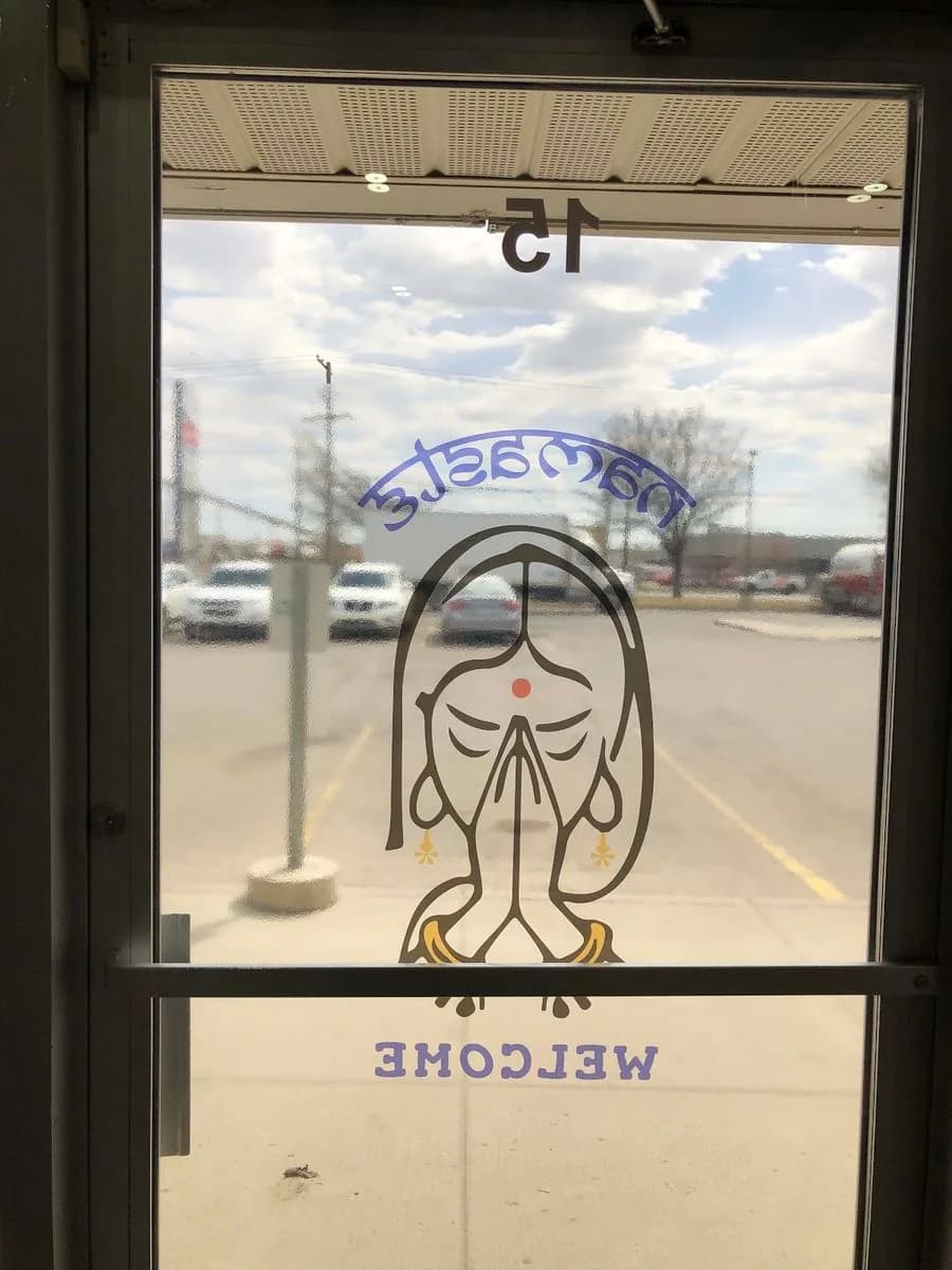 Namaste welcome glass door decal installed in Saskatoon by True Color